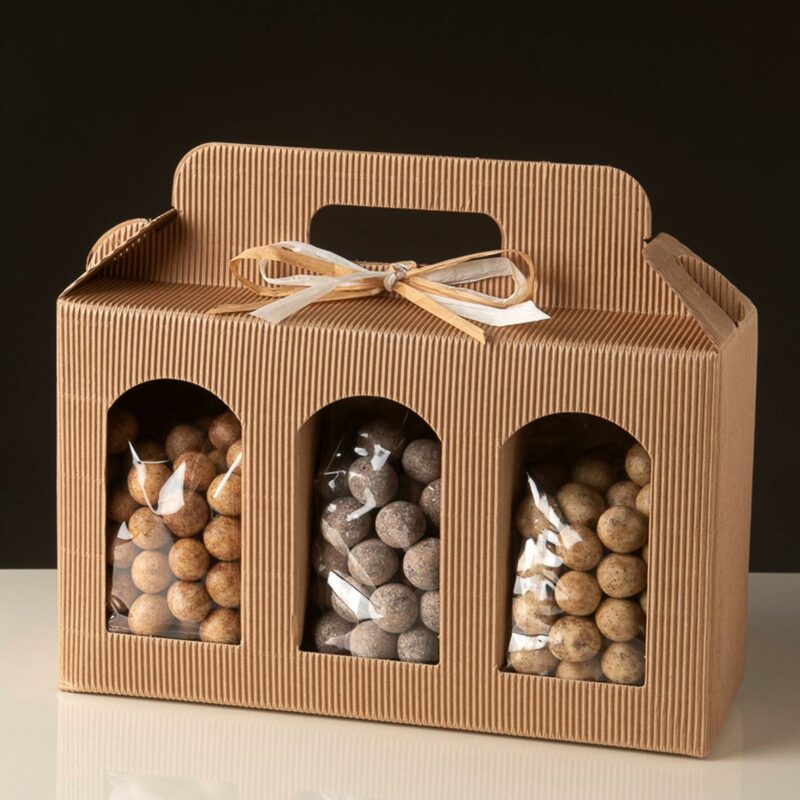 assortment of hazelnuts covered with three chocolates "tris special": toasted and peeled hazelnuts with white chocolate and coffee powder, dark chocolate and sugar, milk chocolate and cinnamon powder